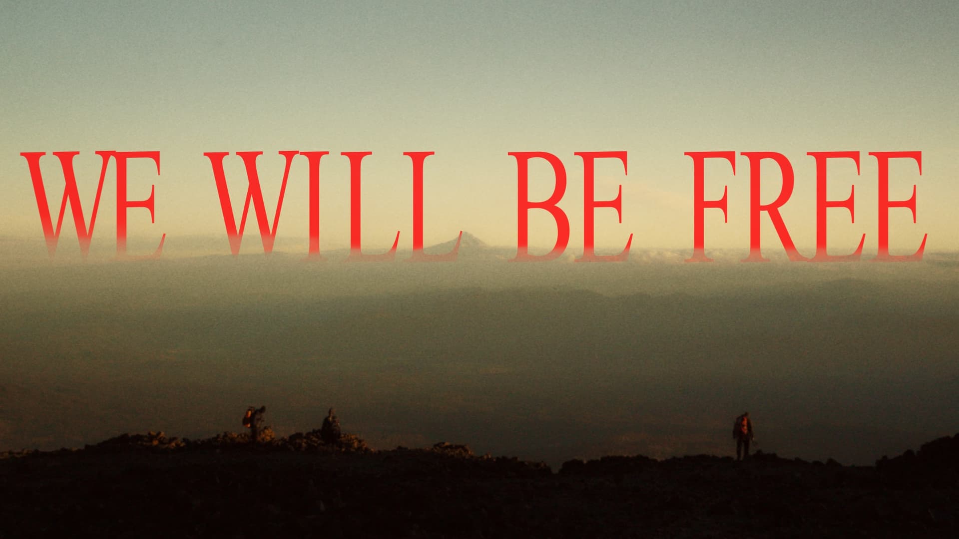 Hikers reflecting by a mountain lake